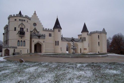 Chateau Charmant on its hill in winter snow